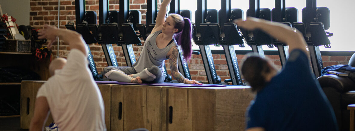 Yoga teacher side stretch